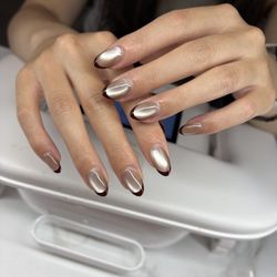 Why Nail - Lily made it for customers. Champagne cat's eye and chocolate French.