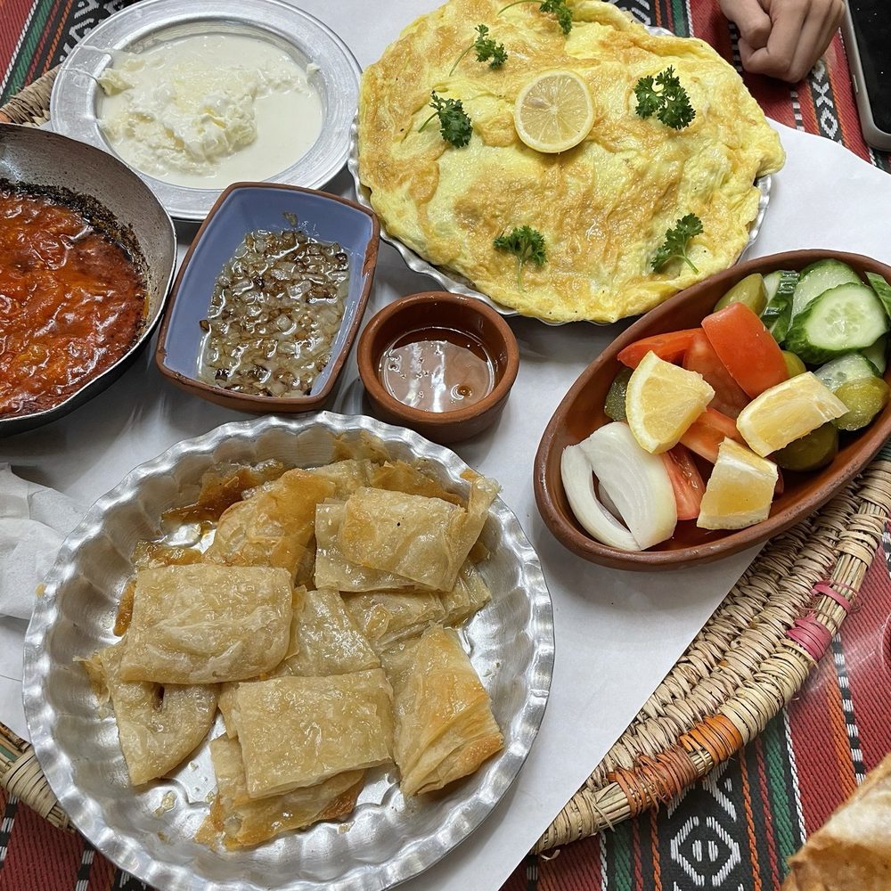 Darbunah - Sauted Tomatoes, Bagilla Bil Dihen, Gaymar and Kaahi with honey. With side veggies, lemon, onion, tomato and cucumbers . - Breakfast & Brunch Near Me - Dearborn, Michigan