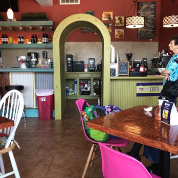 Maximilian Coffee - a woman standing in a coffee shop - Coffee & Tea Near Me - Pensacola, Florida Maximilian Coffee - a woman standing in a coffee shop - Coffee & Tea Near Me - Pensacola, Florida