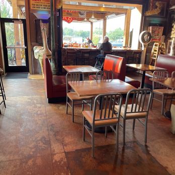 Starbecks Smokehouse - View of the restaurant looking outward. Note the open air window that conjoins the outdoor to the indoor eating area. - Barbeque Near Me - Waterloo, Iowa