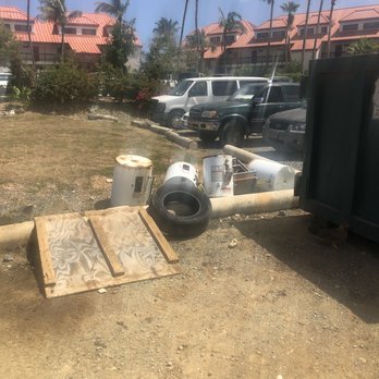 Sapphire Beach Resort - Old Tires and garbage water heaters outside our room. - Hotels Near Me - Saint Thomas, Virgin Islands