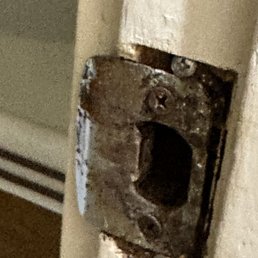 Corroded door hinge
