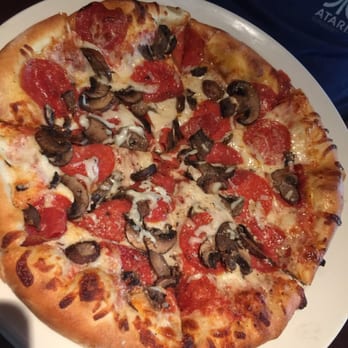 Yard House - Plate sized pepperoni and mushroom pizza - New American Near Me - Orlando, Florida Yard House - Plate sized pepperoni and mushroom pizza - New American Near Me - Orlando, Florida