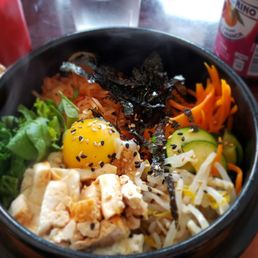 Hot stone bowl bibimbap with kimchee and miso soup.