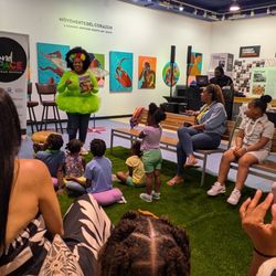 Island SPACE Caribbean Museum - Kids enjoy a reading session with Auntie Denise.