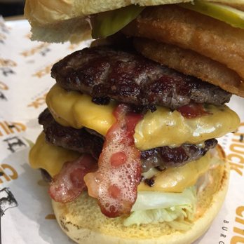 Chuck Burger - 4 patties is pure beef. - Burgers Near Me - The Blue Mountains, Ontario Chuck Burger - 4 patties is pure beef. - Burgers Near Me - The Blue Mountains, Ontario