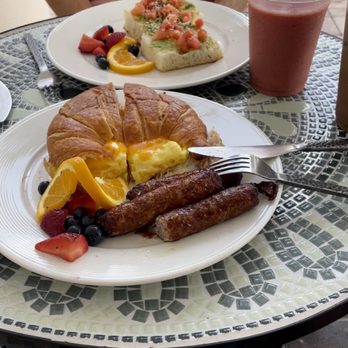 Cafe on The Bay - Avacado toast, tropical strawberry smoothie, egg and cheese sandwhich with sausage, s'mores latte - Cafes Near Me - Naples, Florida Cafe on The Bay - Avacado toast, tropical strawberry smoothie, egg and cheese sandwhich with sausage, s'mores latte - Cafes Near Me - Naples, Florida