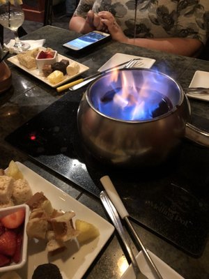 Photo of The Melting Pot - Columbus, OH, US. Flaming turtle dessert fondue with waffles, fruit, cake, brownies, and a marshmallow to dip in!