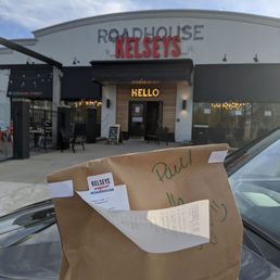 a paper bag on the hood of a car