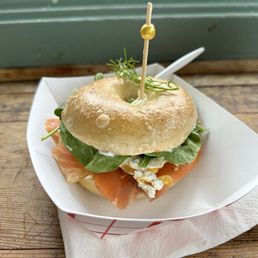 Salmon lox with egg and spinach on a bagel