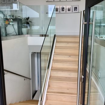 Berard Hardwood Flooring - a staircase with glass railing - Flooring Near Me Berard Hardwood Flooring - a staircase with glass railing - Flooring Near Me