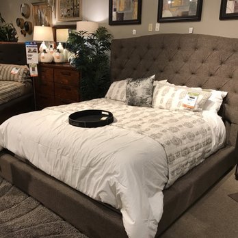 Ashley Store - Cal king upholstered bed reminds me of a Vegas suite - Furniture Stores Near Me - West Covina, California