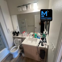 Martinez Cleaning Service - Before: Bathroom sink with visible water spots, buildup, and everyday residue.