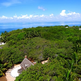 Cape Florida Lighthouse - The lighthouse keeper's cottage is seen below from the platform of the Cape Florida Lighthouse. - Landmarks & Historical Buildings Near Me - Key Biscayne, Florida