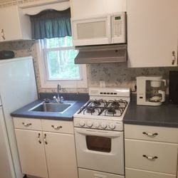 Waters Edge Family Campground - Kitchen with appliances.