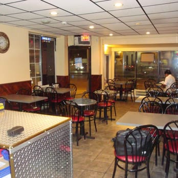 Roti Time - a restaurant with tables and chairs - Indian Near Me - Toronto, Ontario Roti Time - a restaurant with tables and chairs - Indian Near Me - Toronto, Ontario