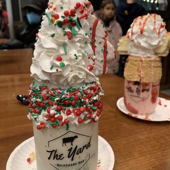 The Yard Milkshake Bar - Little Debbie Christmas tree snack cake shake (front) and strawberry cheesecake shake (back) - Ice Cream & Frozen Yogurt Near Me - Ashburn, Virginia The Yard Milkshake Bar - Little Debbie Christmas tree snack cake shake (front) and strawberry cheesecake shake (back) - Ice Cream & Frozen Yogurt Near Me - Ashburn, Virginia