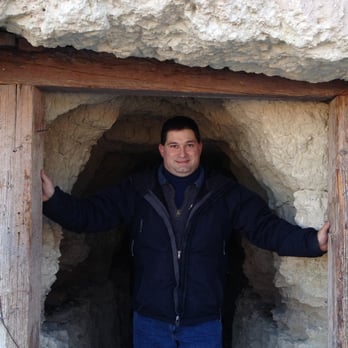 Dublin Gulch - Bryan in the entrance to one of the cave dwellings - Hiking Near Me - Shoshone, California