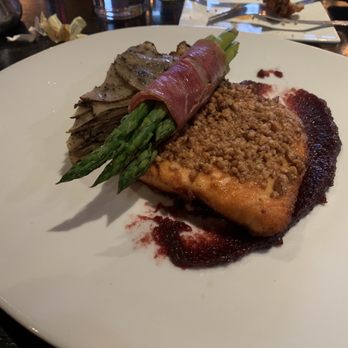 Chelsea Tavern - Salmon topped with walnuts, asparagus wrapped in prosciutto.  Glazed Walnut-Crusted Chilean Salmon - New American Near Me - Wilmington, Delaware
