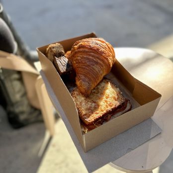 Moonbelly Bakery - Goodie box of classic croissant, Croque Monsieur, and chocolate chip banana bread. - Bakeries Near Me - Sacramento, California Moonbelly Bakery - Goodie box of classic croissant, Croque Monsieur, and chocolate chip banana bread. - Bakeries Near Me - Sacramento, California