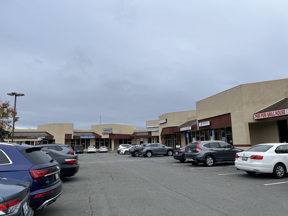 Sunset Village Shopping Center Logo
