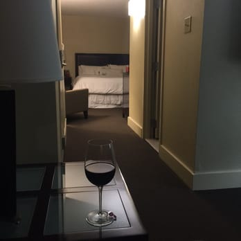 BlueFire Lounge - a glass of wine on a coffee table - New American Near Me - Irving, Texas