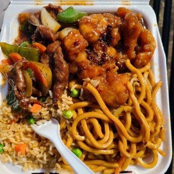 Uncle Ping's Express - 1 side chow mein and rice and 2 entree.  Spicy pork. But the fried pork chicken top right in the picture I didn't like the soy base flavor - Chinese Near Me - Oroville, California