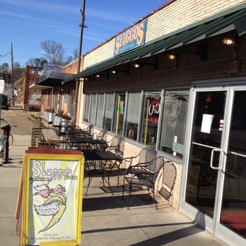 Sluggo's Vegetarian Cafe - On sidewalk approaching restaurant. Cool interior with interesting local art. - Vegetarian Near Me - Chattanooga, Tennessee