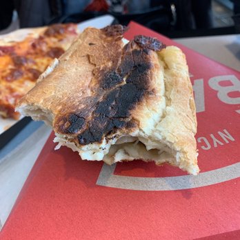Sbarro - a half eaten pizza and half eaten pizza - Italian Near Me - CLYDE, Ohio