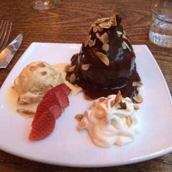 La Coïncidence - Dessert: pear covered in chocolate and nuts, with whipped cream and ice cream on the side! - French Near Me - Paris, 75