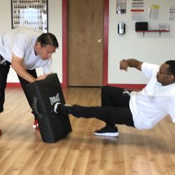 Western Lotus Athletics & Martial Club - John helping Jimmie on his ground defense.