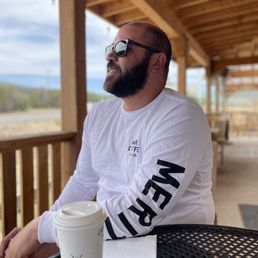 Outdoor seating area and my hubby who was SO happy to finally find some "good" coffee