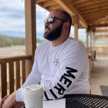 Cabra Coffee - Outdoor seating area and my hubby who was SO happy to finally find some "good" coffee - Coffee & Tea Near Me - Cedar Crest, New Mexico