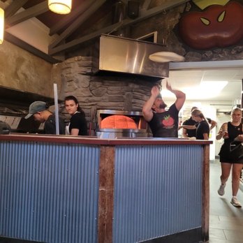 Wild Tomato - This is him throwing the pizzas - Pizza Near Me - Fish Creek, Wisconsin Wild Tomato - This is him throwing the pizzas - Pizza Near Me - Fish Creek, Wisconsin