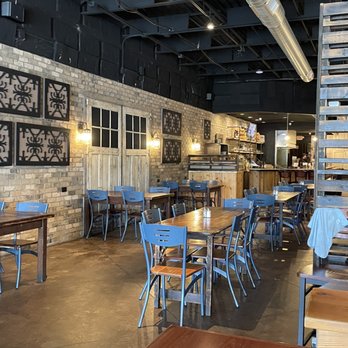 56 Kitchen - Solon - tables and chairs in a restaurant - New American Near Me - Solon, Ohio