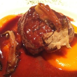 Sirloin steak with mushroom and red wine reduction over carrot purée.
