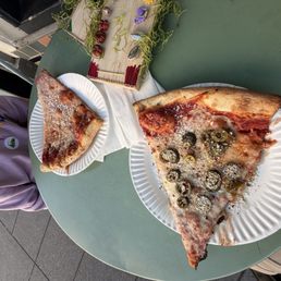 Two cheese slices, one with jalapeños. Two cheese slices, one with jalapeños.