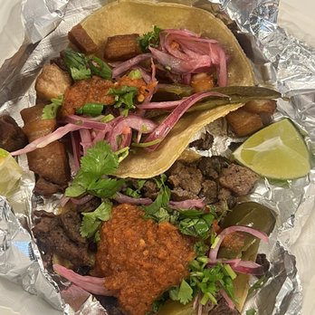 SALUD - Park belly and steak tacos with garnishments of my choosing for the sauce bar. - Bars Near Me - Birmingham, Alabama