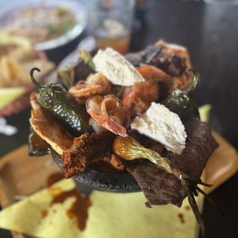 El Jacalito Grill - Molcajete with asada, pollo asado, shrimp, chorizo, jalepenos. - Mexican Near Me - Big Bear Lake, California