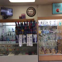 Smoke Shop Etc - Selection of bongs, vape pens and pipes.