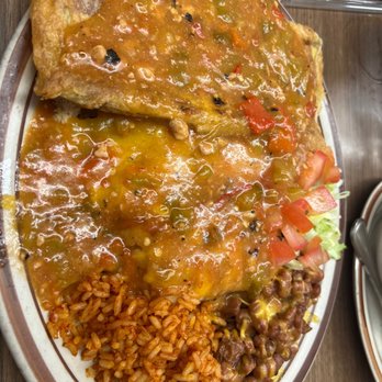 Jerry's Cafe - Left to right Chile rellaño, chicken enchilada and beef tamale with whole beans and rice. Green Chile over all. - New Mexican Cuisine Near Me - Gallup, New Mexico