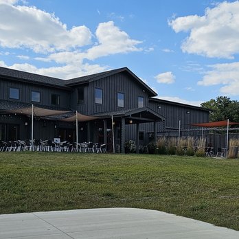 Covered Bridges Winery - patio area with tables and umbrellas - Wineries Near Me - Winterset, Iowa Covered Bridges Winery - patio area with tables and umbrellas - Wineries Near Me - Winterset, Iowa