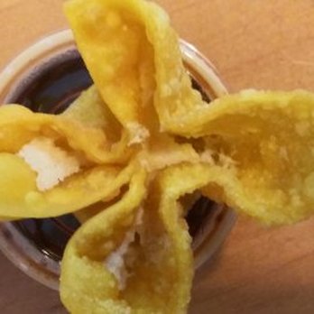 Happy Wok - crab rangoo on top of dumpling dipping sauce container - Chinese Near Me - Richmond Hill, Georgia
