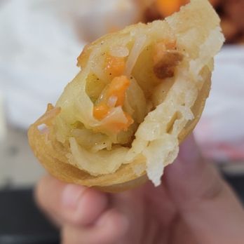 Dragon Garden Express - a hand holding a pastry - Chinese Near Me - Avondale, Arizona Dragon Garden Express - a hand holding a pastry - Chinese Near Me - Avondale, Arizona