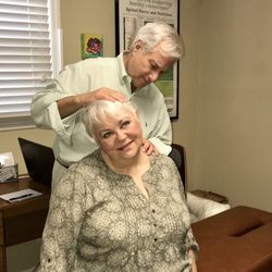Family Chiropractic Center - Dr. Margolies performing a chiropractic examination on one of his patients.