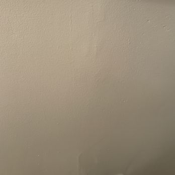 Silverwood Finishing - a remote control on a white wall - Cabinetry Near Me