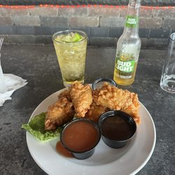 Riverfront Bar & Grill - Bone in chicken wings with sauce on the side.