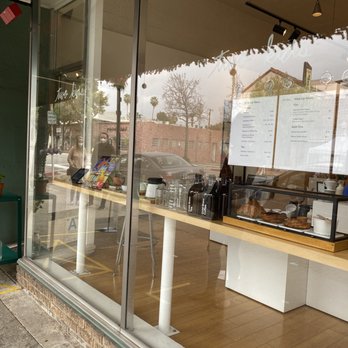 Two Kids - Storefront with clear display of menu and pastries as well as table in doorway for taking contactless orders/payment - Coffee & Tea Near Me - South Pasadena, California Two Kids - Storefront with clear display of menu and pastries as well as table in doorway for taking contactless orders/payment - Coffee & Tea Near Me - South Pasadena, California
