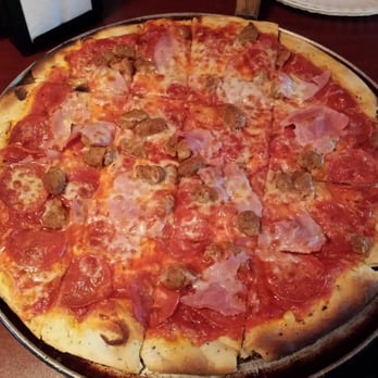 Hogback Pizza - Triple bypass pizza with light cheese, the standard would be extra cheese. Note that its cut in squares. Delicious! - Pizza Near Me - New Castle, Colorado Hogback Pizza - Triple bypass pizza with light cheese, the standard would be extra cheese. Note that its cut in squares. Delicious! - Pizza Near Me - New Castle, Colorado