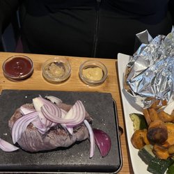 Lava - Steak on a hot plate and cooked it ourselves with mashed potatoes and vegetables so good